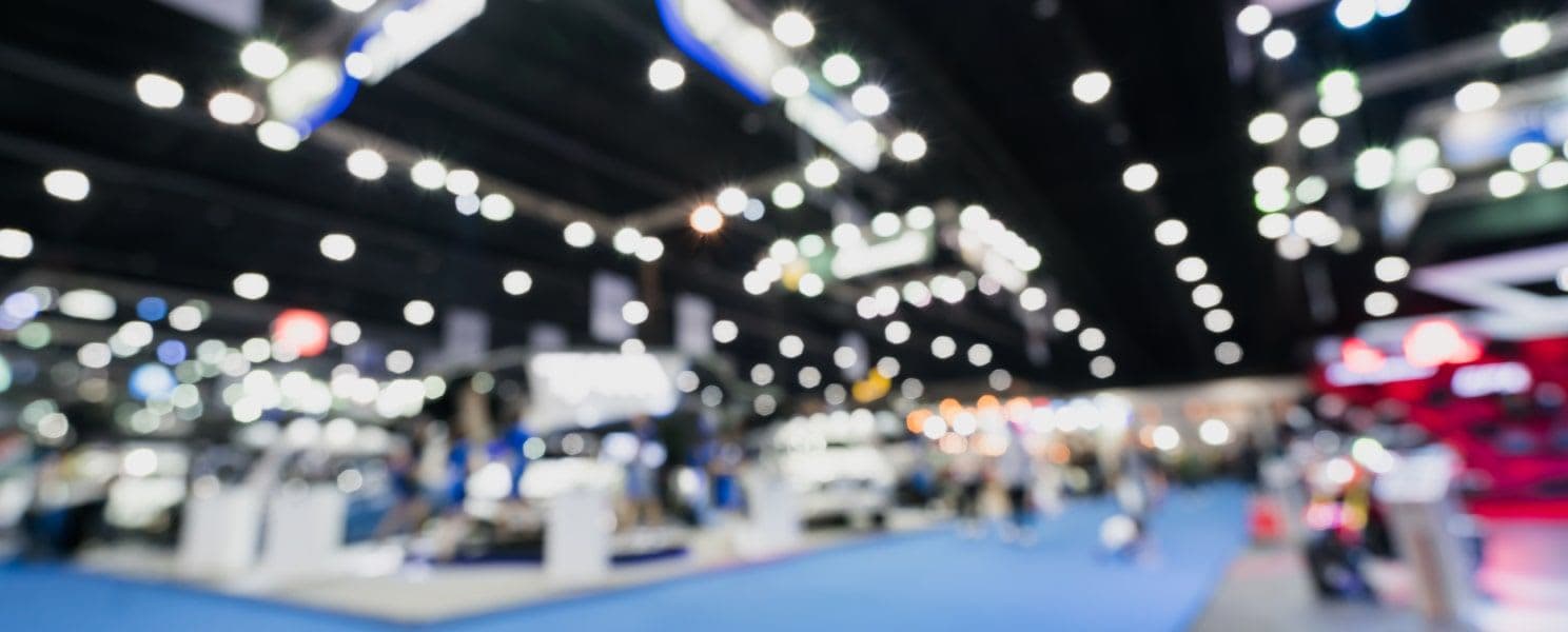 Out of focus shot of wize load trade show floor