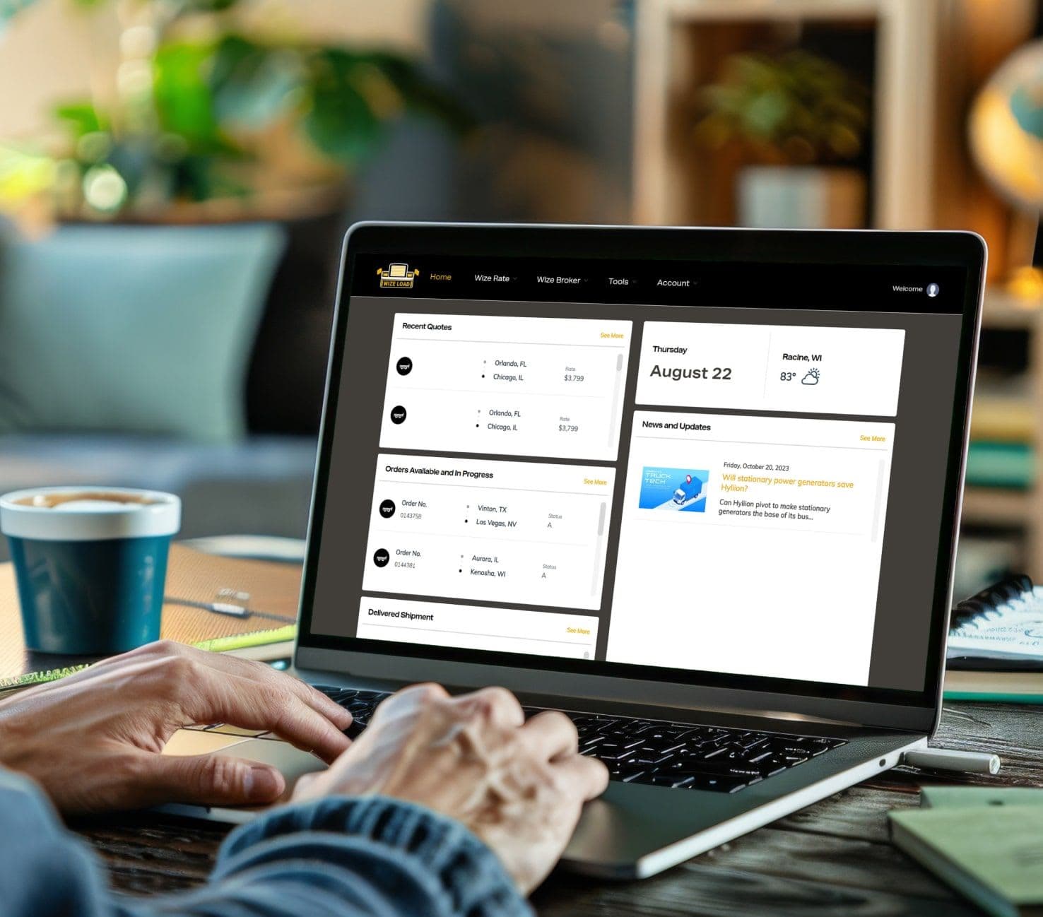 • A logistic professional using the Wizeload software on his laptop to monitor shipping.